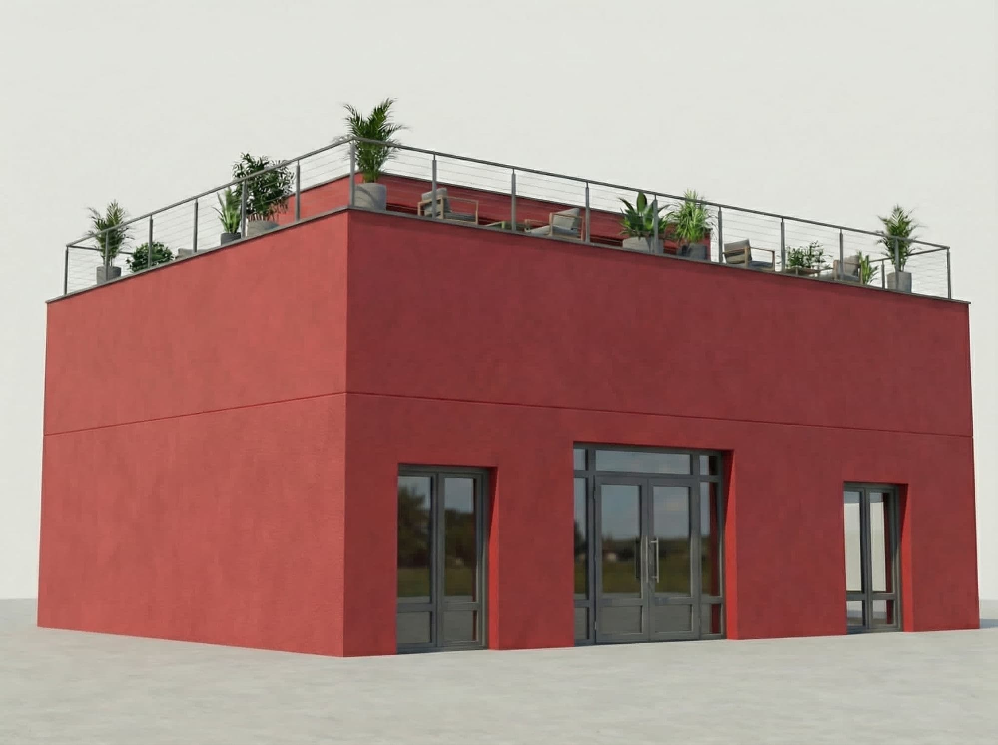 Façade principale de la Maison Bledi en pisé rouge — bâtiment cubique avec trois grandes baies vitrées au rez-de-chaussée et terrasse rooftop ceinturée d'un garde-corps inox, meublée de plantes en pot et fauteuils outdoor